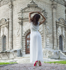 Young woman in a white long dress