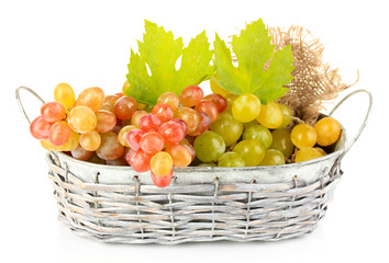 Ripe sweet grape in basket, isolated on white