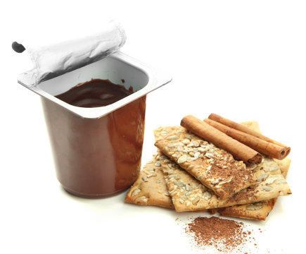 Chocolate cream in open plastic cup isolated on white