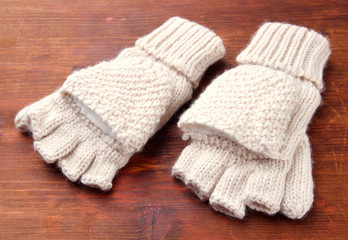 Fototapeta na wymiar Wool fingerless gloves, on wooden background
