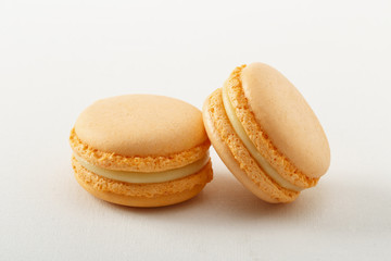 orange macaroon on a white background