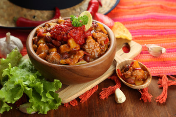 Chili Corn Carne - traditional mexican food, in wooden bowl,