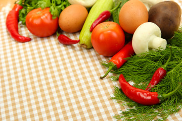 Cooking concept. Vegetables on tablecloth background
