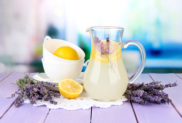 Lavender lemonade, on  violet wooden table, on bright