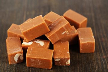 Many toffee on wooden table
