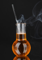 Laboratory beaker on black background