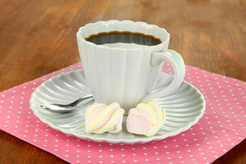 Coffee cup on wooden table close-up