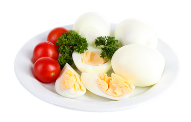 Boiled eggs on plate isolated on white