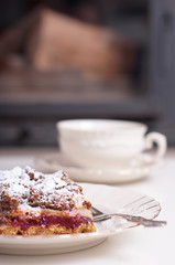 Cake on a plate and coffee.