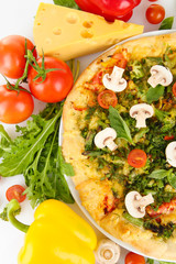 Tasty vegetarian pizza and vegetables, close up