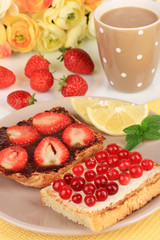 Delicious toast with berries on table close-up