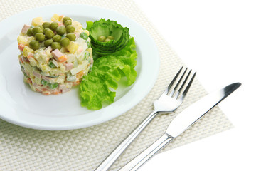 Russian traditional salad Olivier, isolated on white