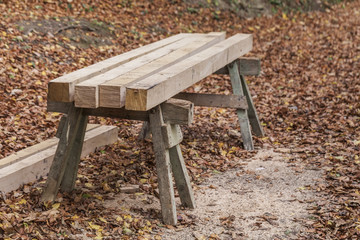 Fototapeta premium Building bar from a tree on the wooden holders in the woods