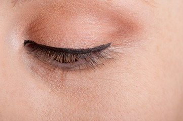 Fototapeta na wymiar Professional makeup artist artist applies eyeliner
