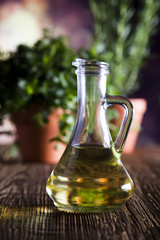 Flagon with olive oil, herbs