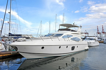 White motor yacht over harbor pier, Odessa, Ukraine