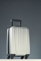 Compact Gray Suitcase