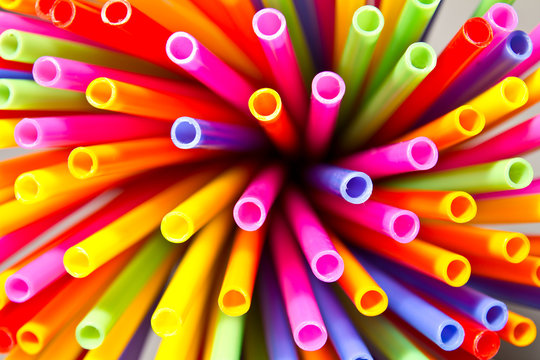 Close-up above many colorful plastic tubes twisted