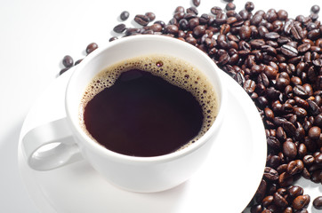 Cup of coffee with bean on white background