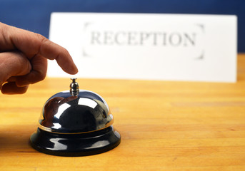 Customer Hand on Hotel Reception