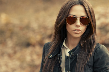 Closeup of a beautiful fashion woman in sunglasses