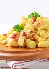 Small potato dumplings with bacon and cabbage