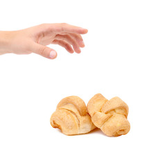 Croissant or crescent roll with hand.