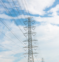 high voltage electrical towers in line