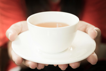 hot tea in hand