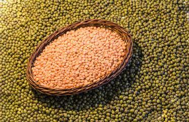 Orange lentils  on green soya backgrond