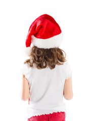 Small girl in santa hat with christmas gift