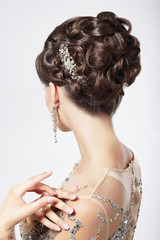 Refinement. Sophistication. Stylish Woman with Festive Coiffure - 57819080