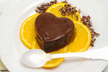 dessert with chocolate pudding and ornage slices