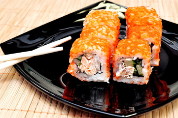 Japanese rolls with masago caviar, cheese and cucumber