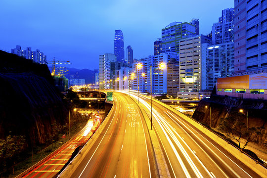 Urban road with light trails in Hong Kong