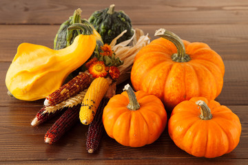 Fresh pumpkins on a wooden table