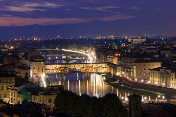 Fototapeta na wymiar Night view of Ponte Vecchio over Arno River in Florence, Italy
