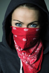 girl hood and red scarf covered face