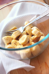 Pieces of banana in a glass bowl