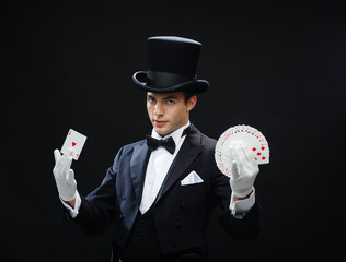 magician showing trick with playing cards