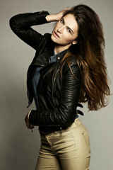 Fototapeta premium Glamorous young woman in black leather jacket