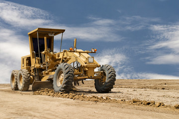 Motor grader working on road construction