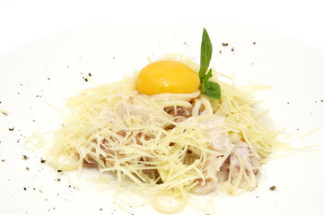 spaghetti with egg on a plate closeup