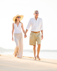 Happy senior couple on the beach. Retirement Luxury Tropical Res