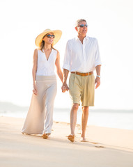 Happy senior couple on the beach. Retirement Luxury Tropical Res