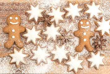 Fototapeta na wymiar gingerbread man cookie, cinnamon stars and star anise