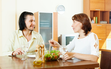   woman with man eating  vegetables salad