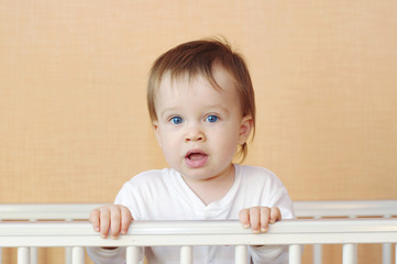 lovely baby in white bed