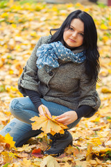 Young pretty woman in autumn park