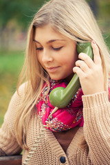 Young blond woman calling